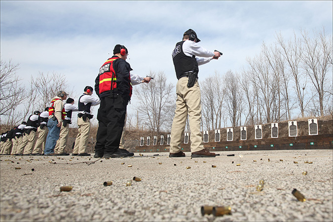 Northwest Indiana Law Enforcement Academy cadets learn how to use a pistol on the outdoor shooting range in Hammond
