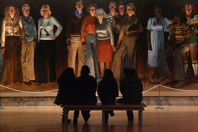 People stop to view the painting 