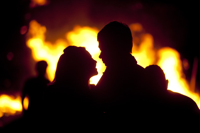Chloe Poehler and Nick Olson share a moment while watching the homecoming bonfire at Sebastian River High School, Friday, Oct 5, 2012. (Staff photo : Tim Hunt)