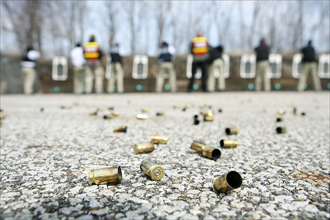 Northwest Indiana Law Enforcement Academy cadets learn how to use a pistol on the outdoor shooting range in Hammond, Tuesday, March 8, 2011.