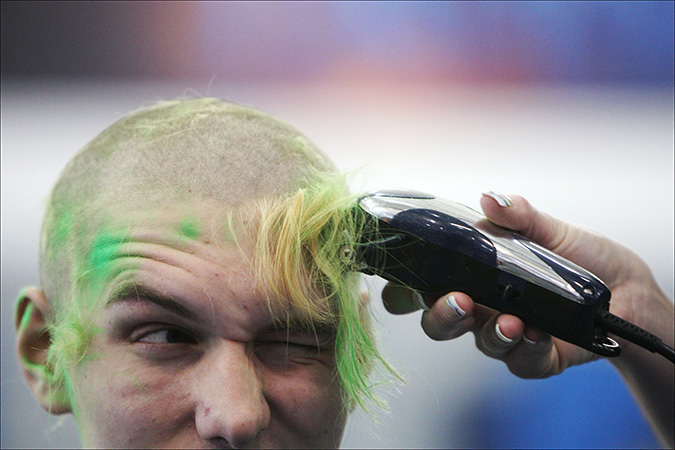 Senior Mike Karas gets his head shaved for the St Baldricks fundraiser in support of pediatric cancer at Lake Central High School, Friday March 18, 2011.