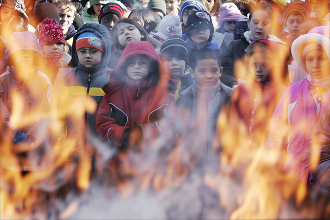 Students at St. Mary School, Griffith, watch as palms are burned in preparation for Ash Wednesday and the beginning of Lent, Feb. 23, 2009.
